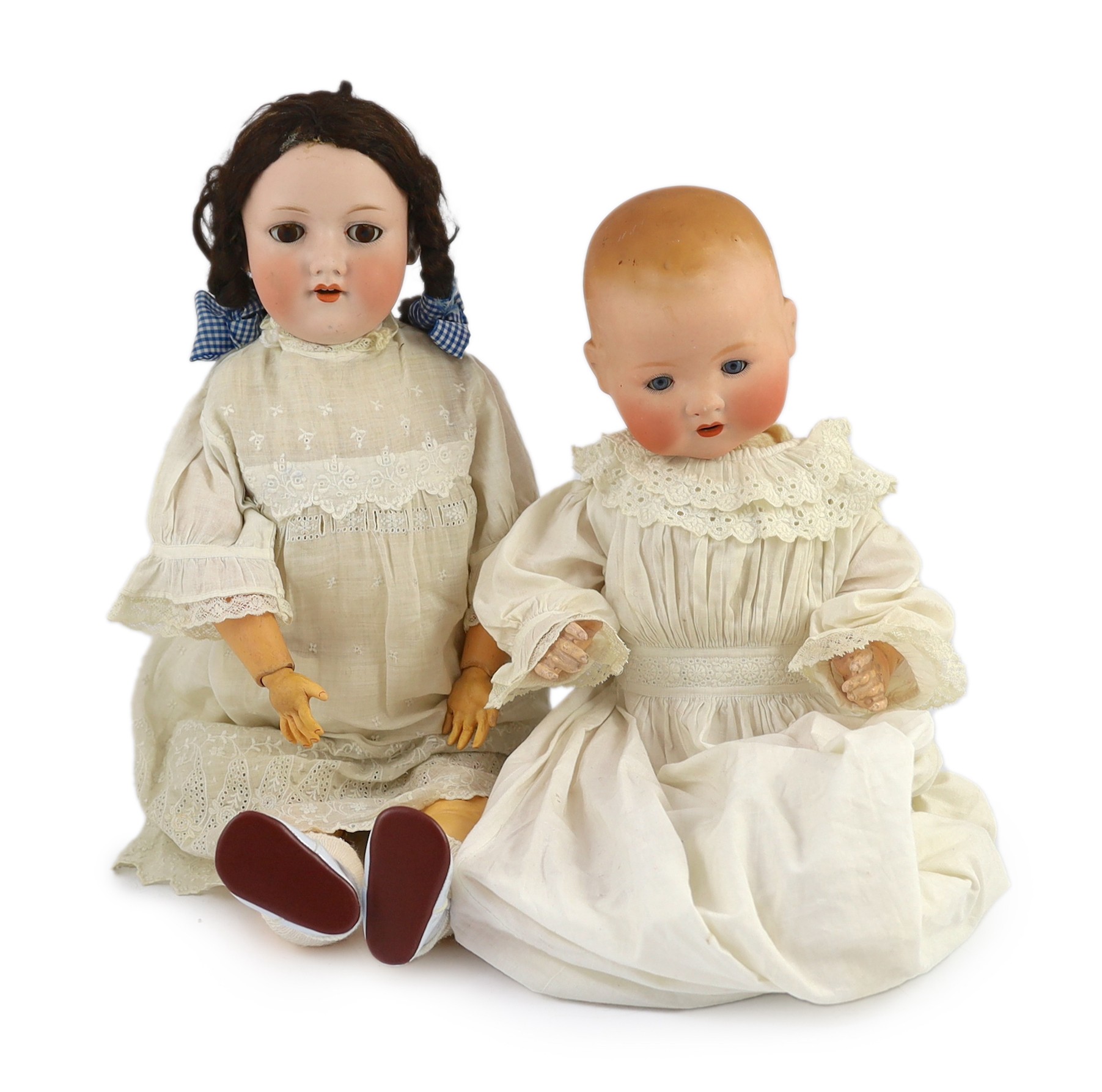 Two Armand Marseille bisque dolls, 23in. and 18in. resp.